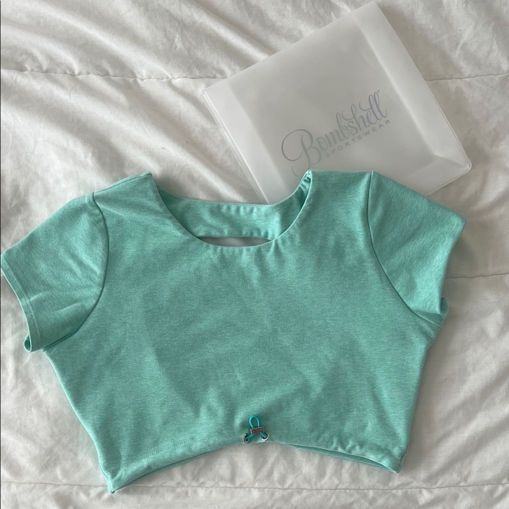Bombshell Toggluxe Tee - color Oasis